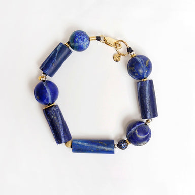 Bold Hippie Trail Bracelet featuring vintage lapis lazuli and sapphire beads in various shapes, finished with gold accents.