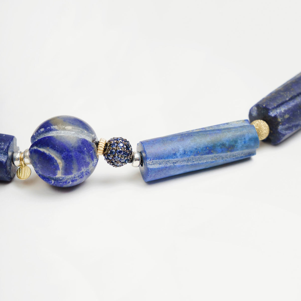 Bold Hippie Trail Bracelet featuring a mix of vintage lapis lazuli beads and sapphire set accents in blue tones.
