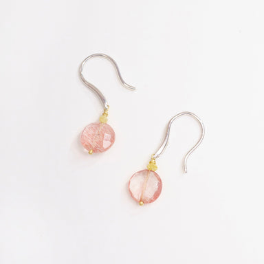 Strawberry Quartz coin earrings with white gold hooks and tiny yellow diamond accents, showcasing a soft pink and gold color palette.