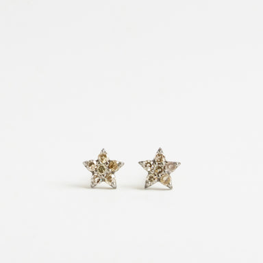 Silver and 9ct yellow gold star-shaped earrings featuring salt and pepper diamonds. Each star measures 5mm.