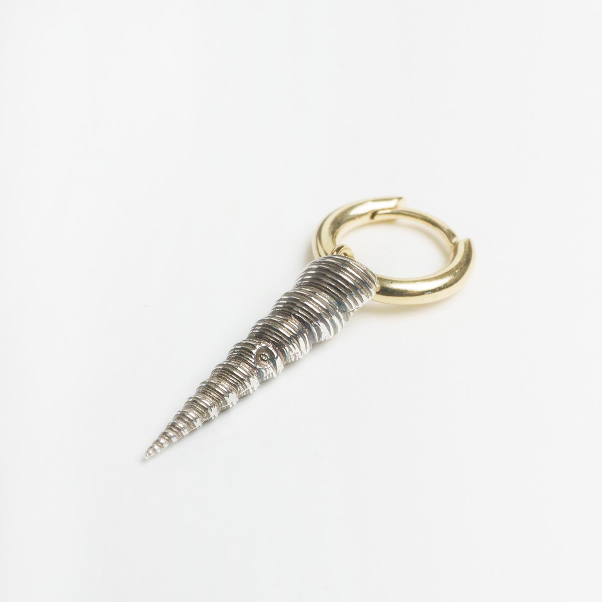 Larrakia Shell Hoops featuring a spiral shell design in sterling silver with a 9ct yellow gold hoop.