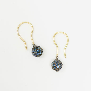 Blue sapphire drop earrings featuring a round bead design in blackened sterling silver, with 18ct yellow gold hooks.