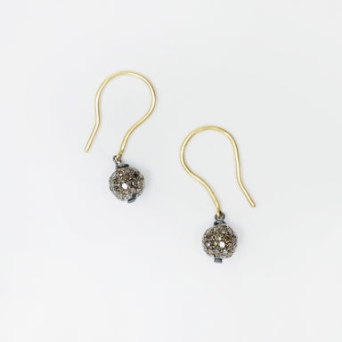 Blackened sterling silver drop earrings featuring 6mm salt and pepper diamond globes with 18k yellow gold hooks.