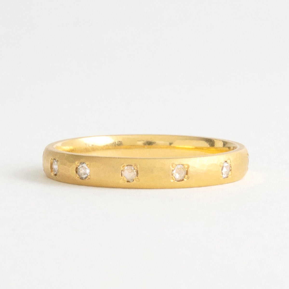 22ct gold eternity ring featuring rose-cut diamonds set around a smooth, 3mm wide band. Simple and elegant design.