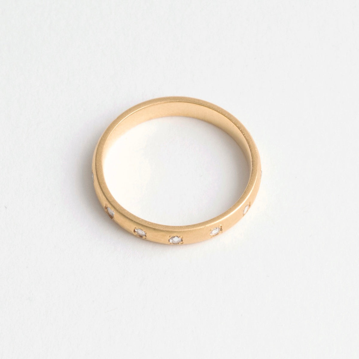 22ct gold eternity ring featuring rose-cut diamonds, 3mm wide band, polished finish, elegant and timeless design.