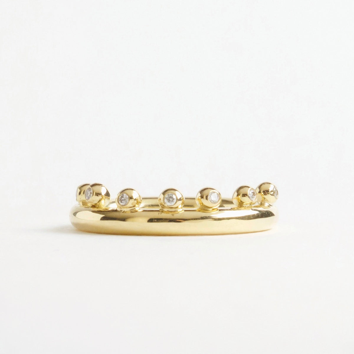 18ct yellow gold ring featuring seven small diamonds set in bubble-like accents along the band.